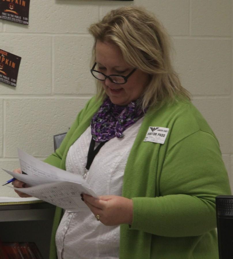 A high school teacher evaluates the activities taking place in an East classroom. 