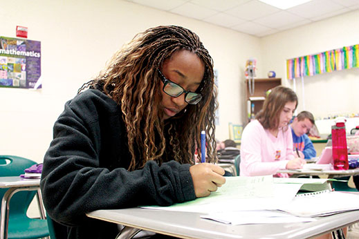 Kyara King studies for pre-calculus; shes stayed focused on academics despite her hardships. | Photography by  Emma Stiefel