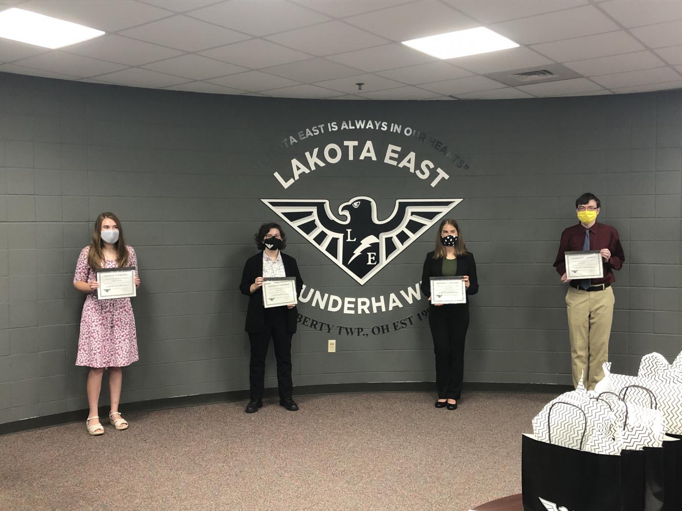 East seniors (left to right) Audrey Earnest, Allison Pratt, Courtney Lyden, and Christopher Mages receive their National Merit Scholarship Semifinalist certificates.