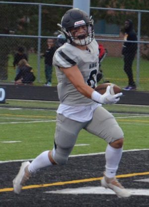 East senior Nick Rabin carries the ball into the endzone in a game in 2021. 