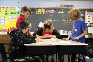 Fourth grade Woodland teacher Stephanie Pare works with students in her integrated classroom. 