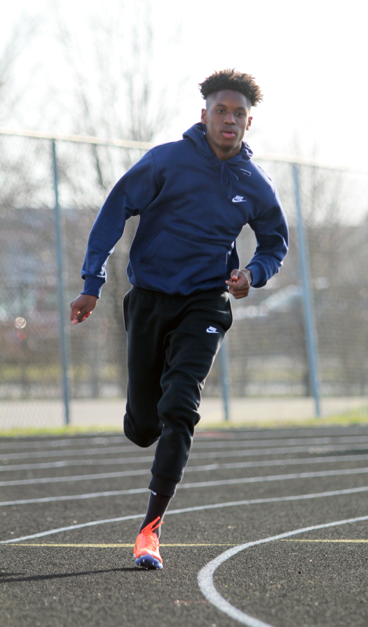 Greg James practices on the track for his upcoming track meet.