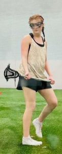 Gracie Mckenna on the lacrosse turf.