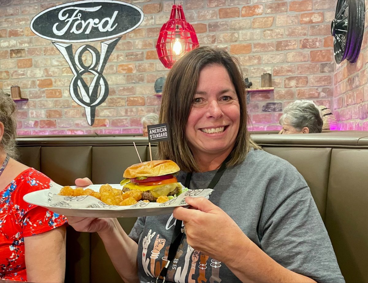 Bowmann poses with the American Standard Burger at Ford’s Garage.