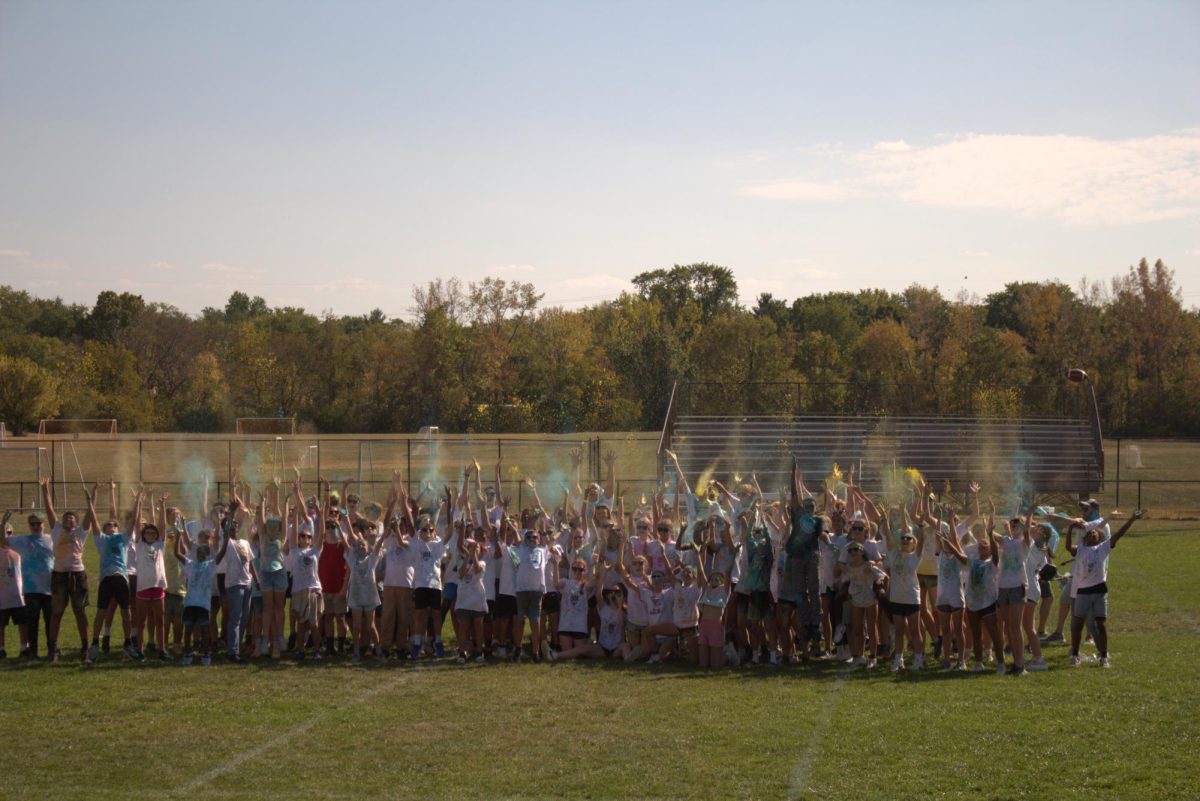 BAll of the particpating students throwing colored powder. Around 200 students in total participated.