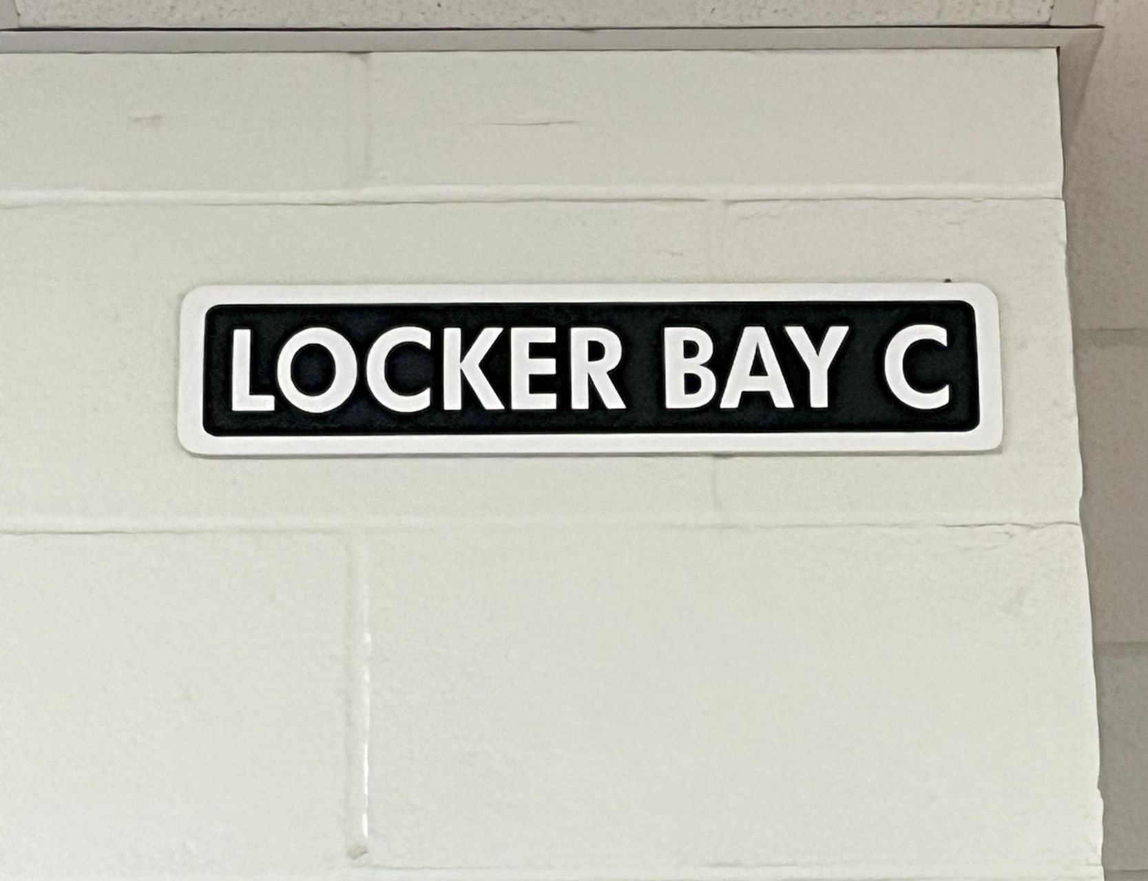 A sign labeled "Locker Bay C".