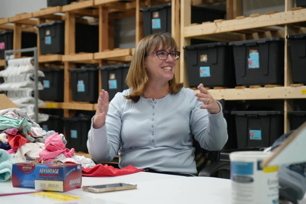 Volunteers converse while taking inventory in the back of Hope’s Closet. At the end of September 2024, there were more than 1280 “shopping” visits from foster children.