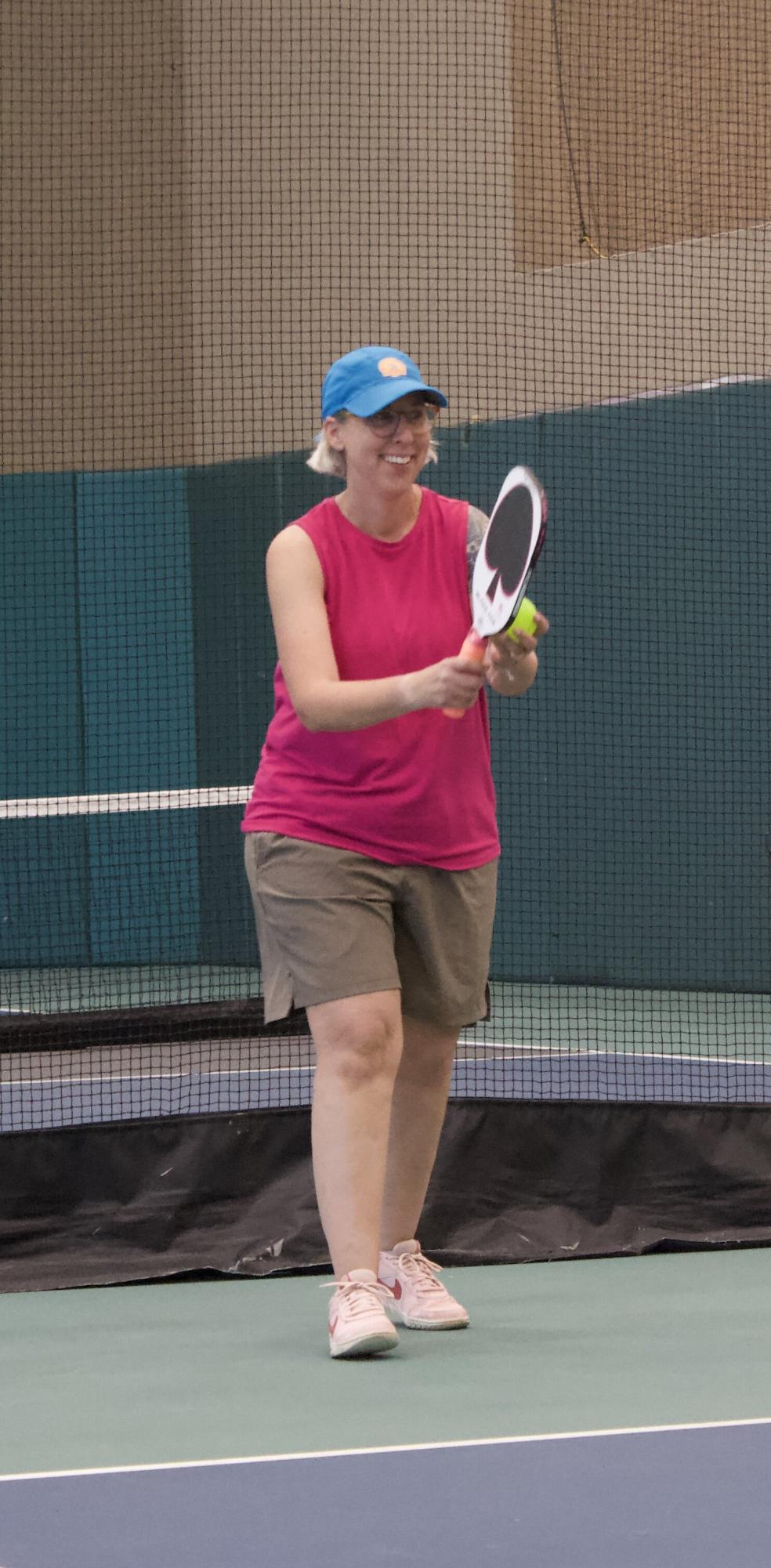 Dusty Columbia begins to set the ball. She and her teammate Peggy Coggins have been playing pickleball since 2020.