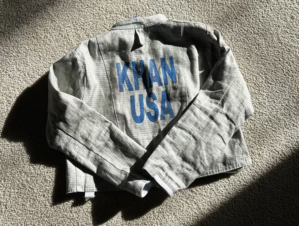 CKhan’s fencing jacket posed after her last match of the season. Khan’s fencing jacket is a staple to her competition attire. The jacket is made out of a heavy gauge cotton fabric that protects the fencer from the sabre.